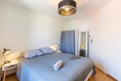 Un ou plusieurs lits dans un hébergement de l'établissement Le 02-GregIMMO-Appart'Hôtel
