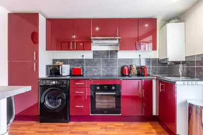 Cuisine ou kitchenette dans l'établissement Le 02-GregIMMO-Appart'Hôtel