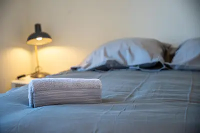Un ou plusieurs lits dans un hébergement de l'établissement Le 02-GregIMMO-Appart'Hôtel