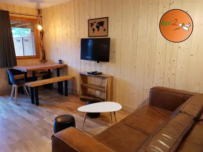 Télévision ou salle de divertissement dans l'établissement Rev2 Montagne