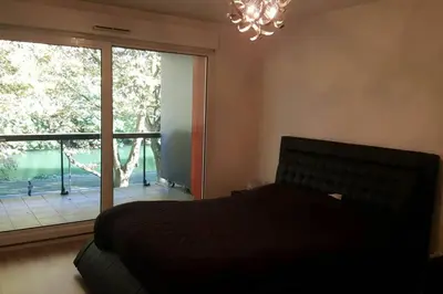 Un ou plusieurs lits dans un hébergement de l'établissement Superbe Duplex au Nouveau Bassin avec vue superbe