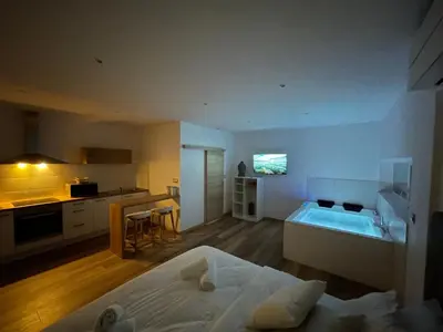 Télévision ou salle de divertissement dans l'établissement Studio Balnéothérapie
