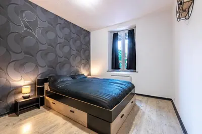 Un ou plusieurs lits dans un hébergement de l'établissement Appart'hotel de la Roseraie
