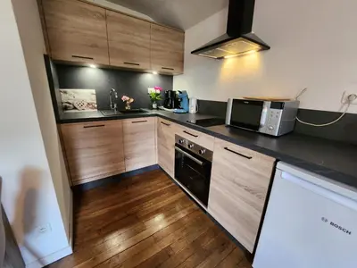 Cuisine ou kitchenette dans l'établissement Gite Myrtille 2 à 6 personnes avec SPA et salle de jeux dans la Residence