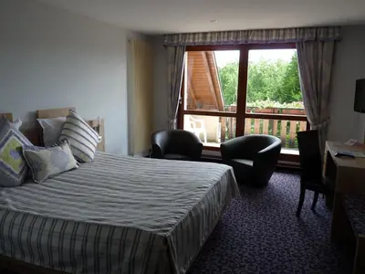 Un ou plusieurs lits dans un hébergement de l'établissement Hotel Restaurant Le Petit Kohlberg