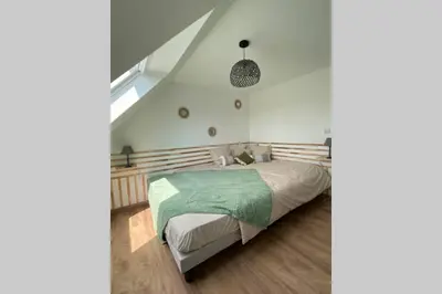 Un ou plusieurs lits dans un hébergement de l'établissement Love Room - L'Atelier Des Nuan'S