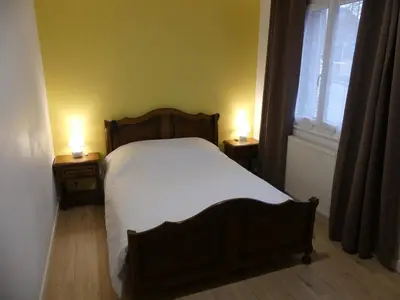 Un ou plusieurs lits dans un hébergement de l'établissement Gite 'chez Cocotte'