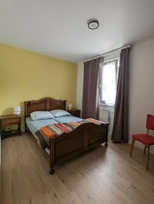 Un ou plusieurs lits dans un hébergement de l'établissement Gite 'chez Cocotte'