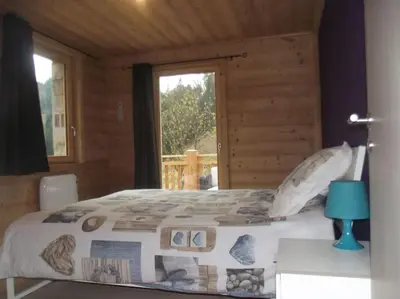 Un ou plusieurs lits dans un hébergement de l'établissement location appartement pied des pistes