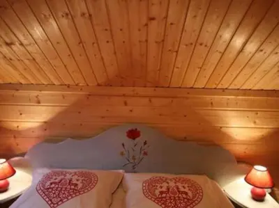 Un ou plusieurs lits dans un hébergement de l'établissement chalet de montagne