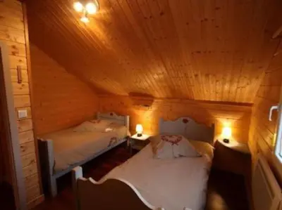 Un ou plusieurs lits dans un hébergement de l'établissement chalet de montagne
