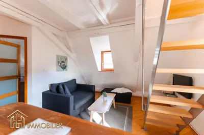 Coin salon dans l'établissement Au Bonheur des Anges Appartement duplex