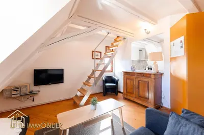 Télévision ou salle de divertissement dans l'établissement Au Bonheur des Anges Appartement duplex