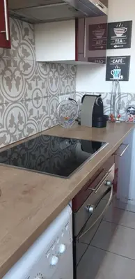 Cuisine ou kitchenette dans l'établissement LA BELLE ESCALE