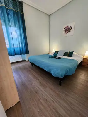 Un ou plusieurs lits dans un hébergement de l'établissement Gite Fougère 2 à 6 personnes avec SPA et salle de jeux dans la résidence