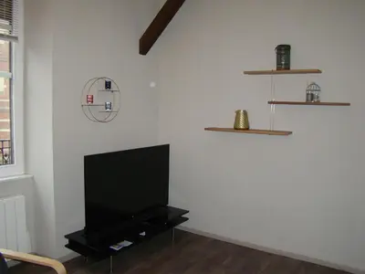 Télévision ou salle de divertissement dans l'établissement Le Rohan