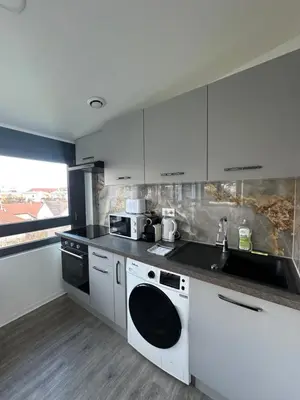 Cuisine ou kitchenette dans l'établissement Le 14 - Nouveau T3 rénové - stationnement gratuit - Mulhouse Riedisheim