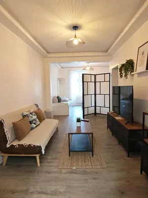 Coin salon dans l'établissement Le 14 - Nouveau T3 rénové - stationnement gratuit - Mulhouse Riedisheim