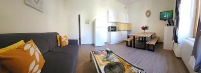 Coin salon dans l'établissement Gîte Jonquille, 2 à 8 personnes avec salle de jeux et SPA dans la résidence