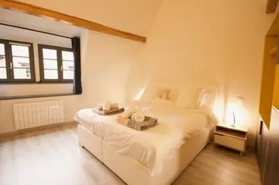 Un ou plusieurs lits dans un hébergement de l'établissement Appartement Le Ch'ti Alsacien