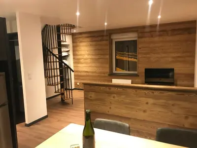 Télévision ou salle de divertissement dans l'établissement Le Duplex