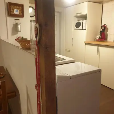 Cuisine ou kitchenette dans l'établissement Au jardin de Lucie