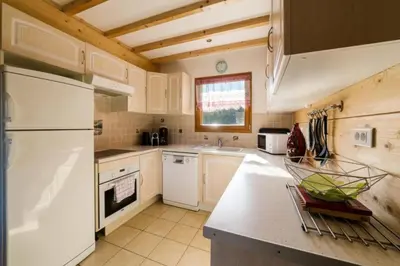 Cuisine ou kitchenette dans l'établissement Le Refuge du Cerf