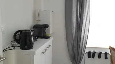 Cuisine ou kitchenette dans l'établissement Studio cosy black - Cosy & Cocon