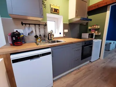 Cuisine ou kitchenette dans l'établissement Maisonnette Soultzmatt