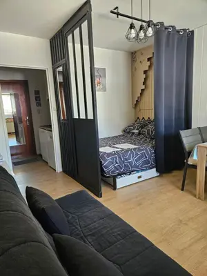 Coin salon dans l'établissement Appartement Vue sur les pistes de ski et en bas de la station