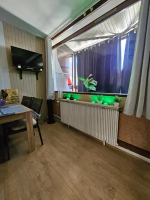 Télévision ou salle de divertissement dans l'établissement Appartement Vue sur les pistes de ski et en bas de la station