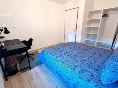 Un ou plusieurs lits dans un hébergement de l'établissement LE FERRETTE - Appartement moderne et confortable