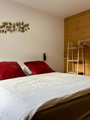 Un ou plusieurs lits dans un hébergement de l'établissement Chalets Capucine ou Clochette 5P - SPA Privatif