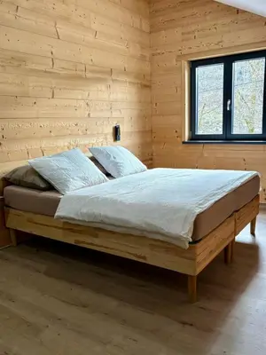 Un ou plusieurs lits dans un hébergement de l'établissement Chalets Capucine ou Clochette 5P - SPA Privatif