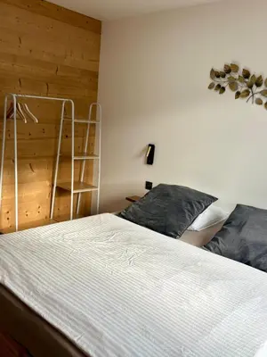 Un ou plusieurs lits dans un hébergement de l'établissement Chalets Capucine ou Clochette 5P - SPA Privatif