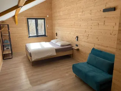 Un ou plusieurs lits dans un hébergement de l'établissement Chalets Capucine ou Clochette 5P - SPA Privatif