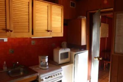 Cuisine ou kitchenette dans l'établissement appartement mitoyen dans chalet
