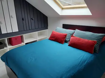 Un ou plusieurs lits dans un hébergement de l'établissement Au Paradis du Loft Joyeux