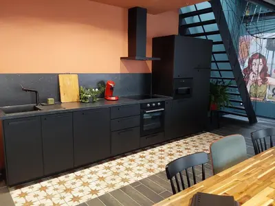 Cuisine ou kitchenette dans l'établissement Au Paradis du Loft Joyeux