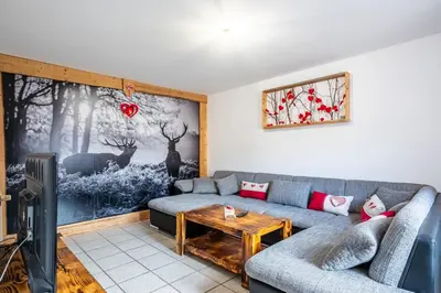Coin salon dans l'établissement Gite de la voie verte gitesdes2vallees