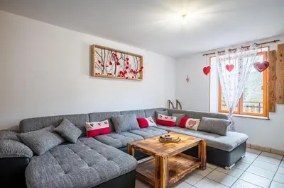 Coin salon dans l'établissement Gite de la voie verte gitesdes2vallees