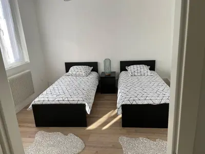 Un ou plusieurs lits dans un hébergement de l'établissement appartement le fil d'or