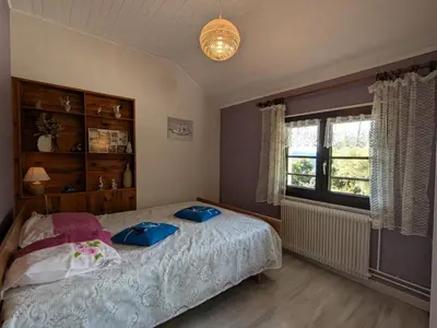 Un ou plusieurs lits dans un hébergement de l'établissement Gîte fonctionnel avec terrasse et vue, Gérardmer - FR-1-589-402