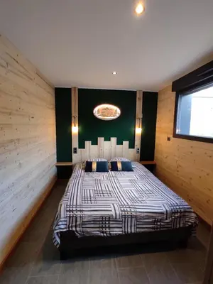 Un ou plusieurs lits dans un hébergement de l'établissement Domaine Nature Cottage Vosges Spa