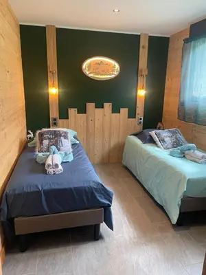 Un ou plusieurs lits dans un hébergement de l'établissement Domaine Nature Cottage Vosges Spa