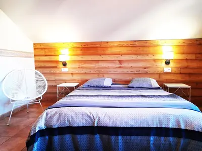 Un ou plusieurs lits dans un hébergement de l'établissement ⁂⁂ GITE LES HERABLES [CLEDICIHOME] Gîte de charme // JACCUZI // SALLE DE JEUX ⁂⁂