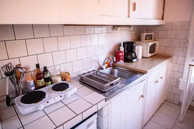 Cuisine ou kitchenette dans l'établissement Studio cosy au cœur de Jaurès