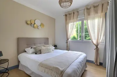 Un ou plusieurs lits dans un hébergement de l'établissement Evasion 4 étoiles Spa privé aux Libellules 12 pers Montagne Vosges