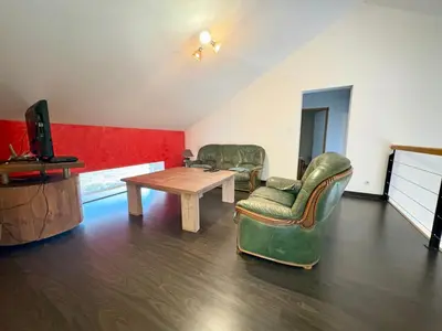 Coin salon dans l'établissement Gîte Du bois le Renard proche Gerardmer