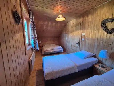 Un ou plusieurs lits dans un hébergement de l'établissement Le chalet de la Chouille